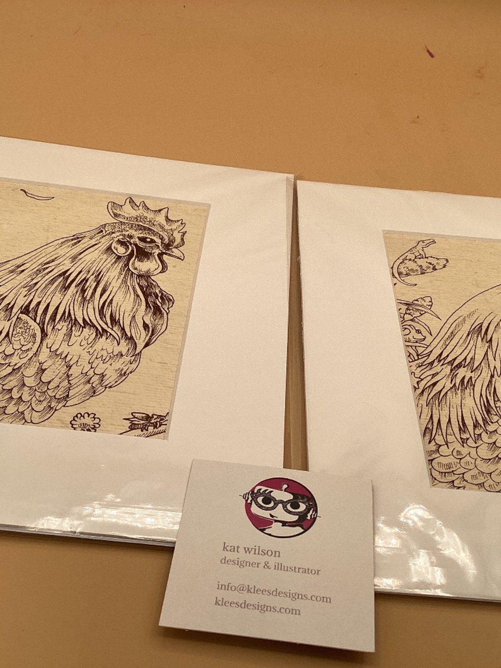 Roosters pair of pen and ink drawings by Kat Wilson.